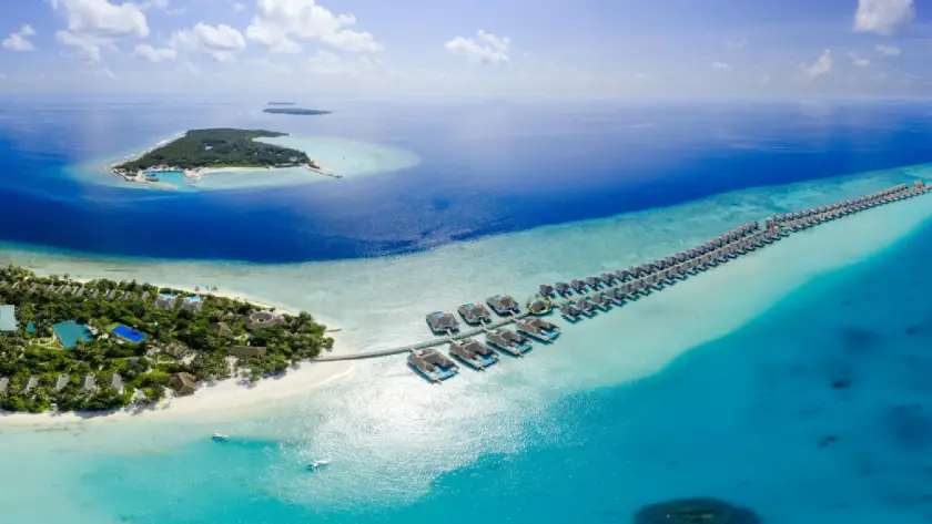 Maldives aerial view with beach resorts and overwater villas