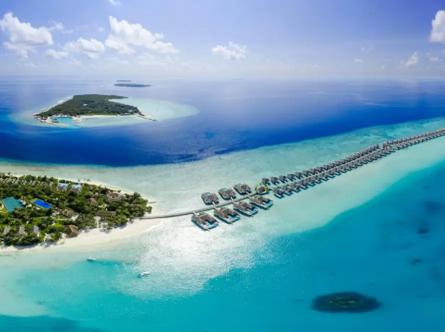 Maldives aerial view with beach resorts and overwater villas