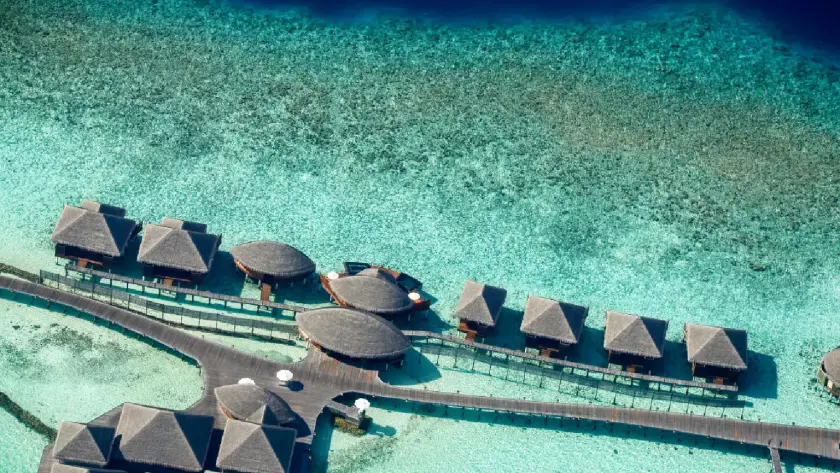 Maldives overwater villas with turquoise lagoon