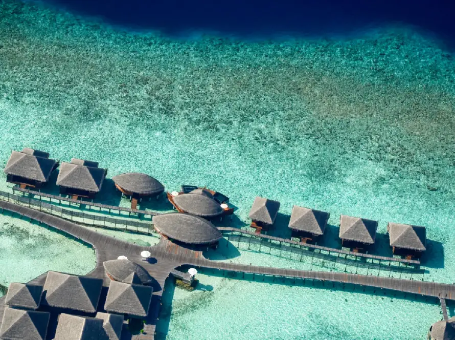 Maldives overwater villas with turquoise lagoon