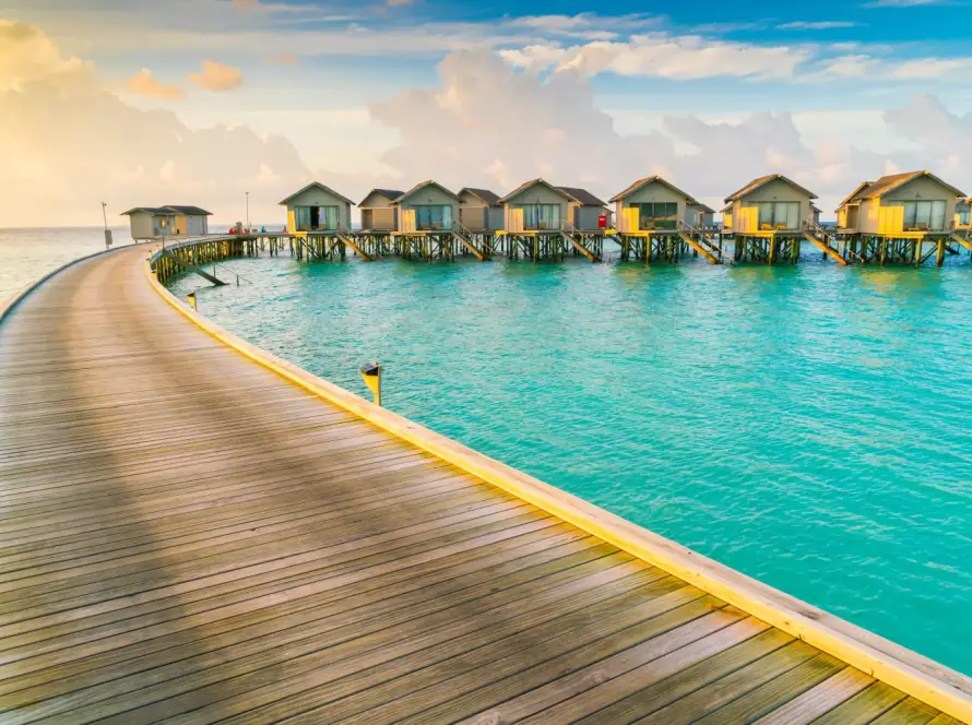 Overwater villas in Maldives surrounded by turquoise sea
