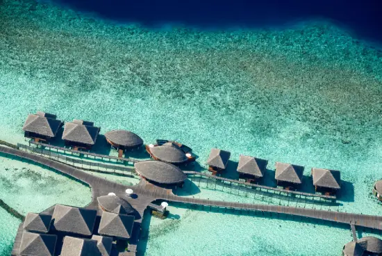 Maldives overwater villas with turquoise lagoon